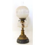 A Victorian oil lamp with clear glass reservoir Condition reports are not available for our