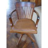An early 20th century oak revolving office chair Condition reports are not available for our