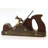 Steel and brass smoothing plane with saw grip, rosewood handle. Condition reports cannot be done for
