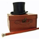 A silver topped cane, also a top hat in a leather case by Lincoln Bennett, London Condition