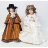 Two modern dolls with porcelain heads Condition reports are not available for this sale.