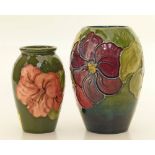 Moorcroft clematis pattern vase and a hibiscus vase Condition reports are not available for this