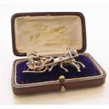 White metal brooch depicting a horse drawn sledge. Condition reports are not available for this