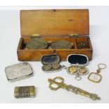 A set of portable balance scales, brass travel scissors, plated coin case and other decorative