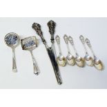 Five silver tea spoons, two silver tea strainers and a silver pair of tongs Condition reports are