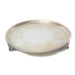 Plain polished silver salver on three scrolling feet, marks for Tessiers Ltd, London Condition