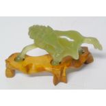 Chinese jade horse with wood stand Condition reports are not available for this sale.