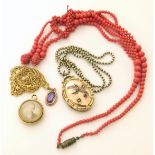 Three assorted pendants including a 9ct gold locket with see pearl swallow design on plated chain,