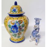 FaÃ¯ence lidded case and a dragon candlestick Condition reports are not available for this sale.