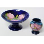 Moorcroft magnolia pattern tazza and a clematis pattern small vase Condition reports are not