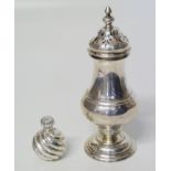 A silver sugar shaker of baluster form on pedestal foot, marks for Charles Edwards, London 1907, and