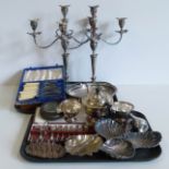 A pair of plated candelabras, plated three piece tea set, oak cased set of fish eaters, three