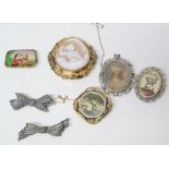 Three Victorian brooches and two silver bow brooches and two costume pendants Condition reports