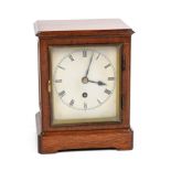 A late 19th century single fusee movement mantle clock. The mahogany case has bevelled glass