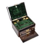A Victorian Coromandel dressing box. The hinged case has brass fretwork mounts, mother of pearl
