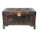 First half 20th century carved Chinese camphor chest, top decorated with duelling warriors on