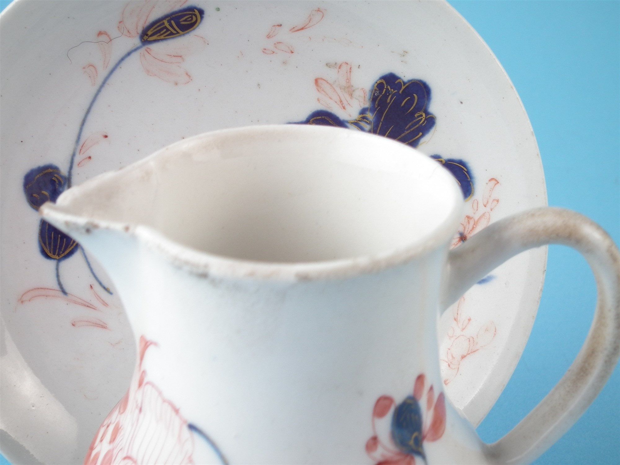 Bow jug and a saucer circa 1755 , painted with flora in an imari palette, both have 'W' marks to - Image 3 of 6