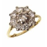 Diamond cluster 18ct gold ring , the flower head cluster comprising a total of 9 round brilliant cut