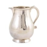 Georgian silver sparrow beak jug of baluster form with s-scroll handle and flared base, 11cm high,