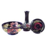 Moorcroft Orchid vase, also a Pansy pattern pin dish and Hibiscus pattern bowl, (3) the vase