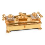 A 19th century gilt bronze inkstand with lion. The double rope handled tray with single drawer is