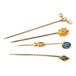 Set of four yellow gold stick pins , comprising one opal set, 8mm x 6mm, length of pin approx. 48mm,