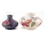 Two Moorcroft vases, one decorated with Butterfly pattern after Rachel Bishop, the other with