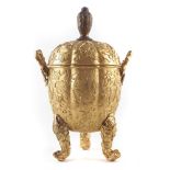 Chinese gilt copper lidded box , the lobed melon shape body worked in medium relief on a stippled