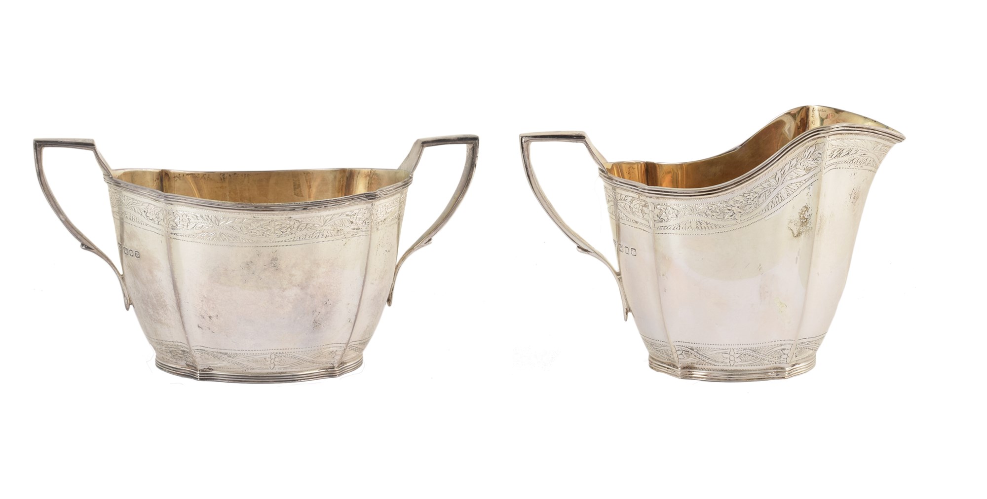 Four-piece silver tea set by Garrard & Co , comprising teapot, hot water jug, sugar bowl and milk