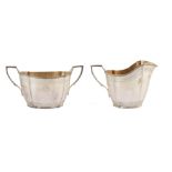 Four-piece silver tea set by Garrard & Co , comprising teapot, hot water jug, sugar bowl and milk