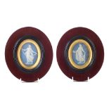 Pair of Wedgwood Jasper oval plaques , depicting Goddesses, set within oval mahogany frames,