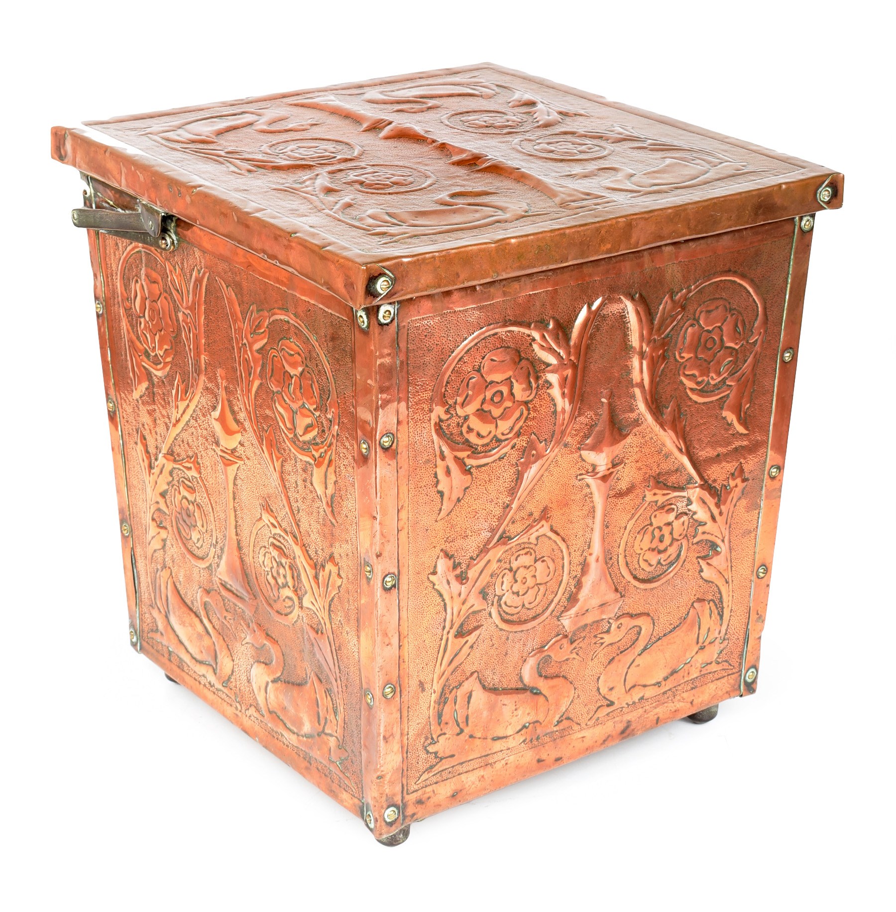 An Arts & Crafts movement copper coal scuttle. Embossed with a design of birds and Tudor roses. With