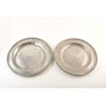 Two 18th century pewter chargers. With unidentified touch marks to rim. 42 and 43cm diameter. For