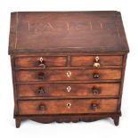 An early 19th century mahogany apprentice chest of drawers. With the initials 'P. A' and the date '