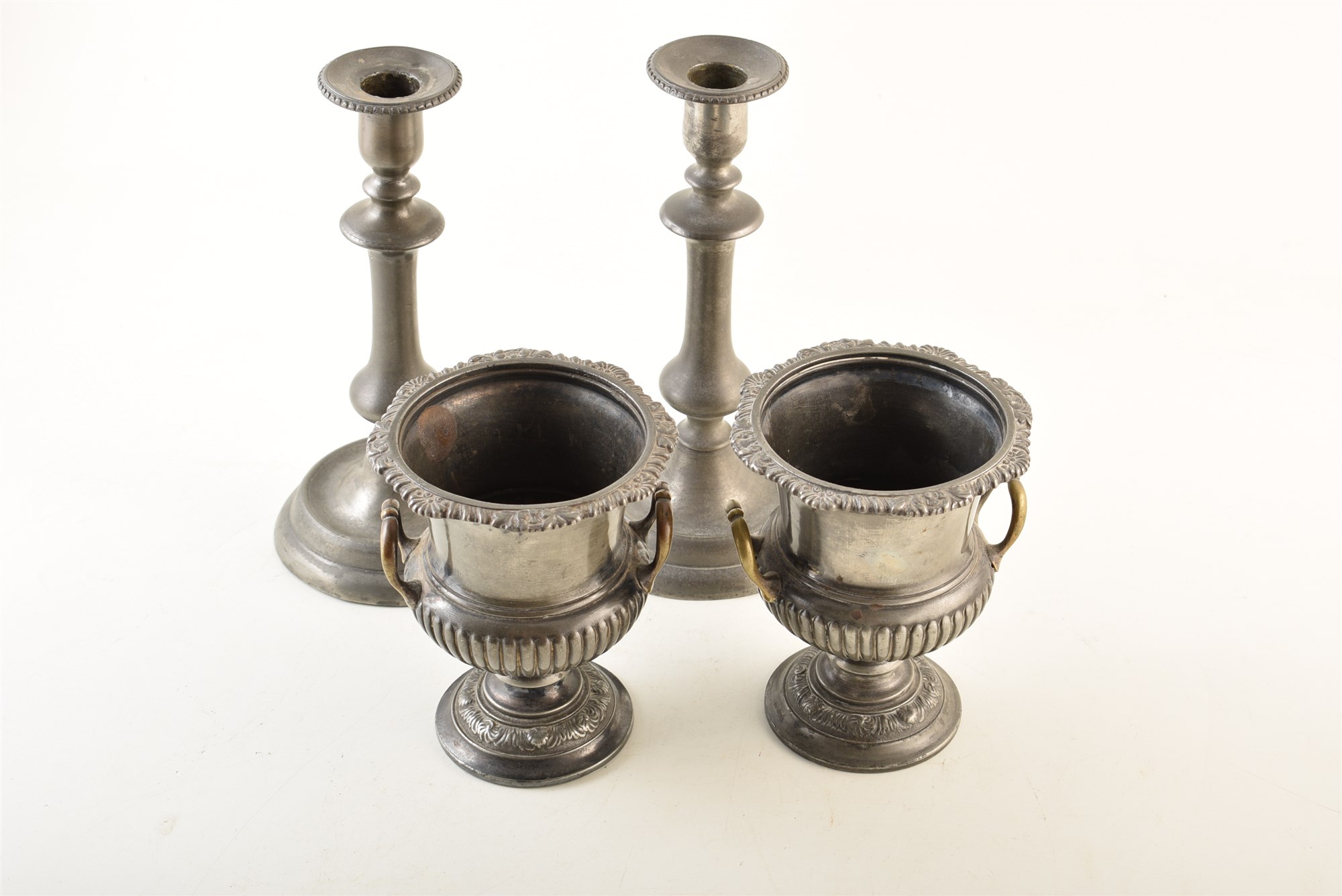 A pair of 19th century campana urns with brass handles and a pair of 19th century pewter