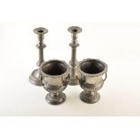 A pair of 19th century campana urns with brass handles and a pair of 19th century pewter
