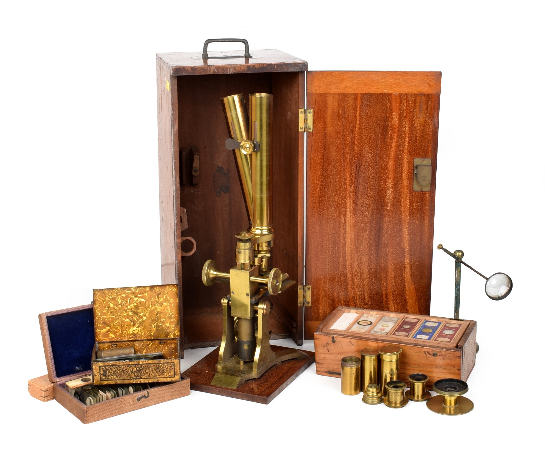 A late 19th century brass microscope by Edmund Wheeler, London. The brass binocular microscope is