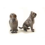 Early 20th century pewter pepperette in the form of an owl with amber glass eyes and another