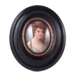 Leslie Johnson oval miniature on porcelain plaque , painted with a portrait of a lady, 6cm high, the