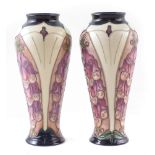 Pair of Moorcroft vases, decorated with foxgloves pattern after Rachel Bishop, one with box, (2)