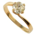 Diamond solitaire 18ct gold ring with cross-over shoulders , central cushion cut diamond measuring