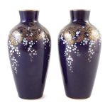 Pair of Sevres vases signed R. Jeandot, decorated with white blossom and gilt leaves on a navy