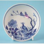 Unusual Chinese soft paste porcelain saucer circa 1750, painted with an exotic birds in under