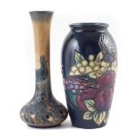 Two Moorcroft vases, decorated with Peacock Feathers after Rachel Bishop, and Finches pattern