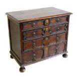 17th century oak chest of four graduated drawers, six plank top with moulded edge, drawers with