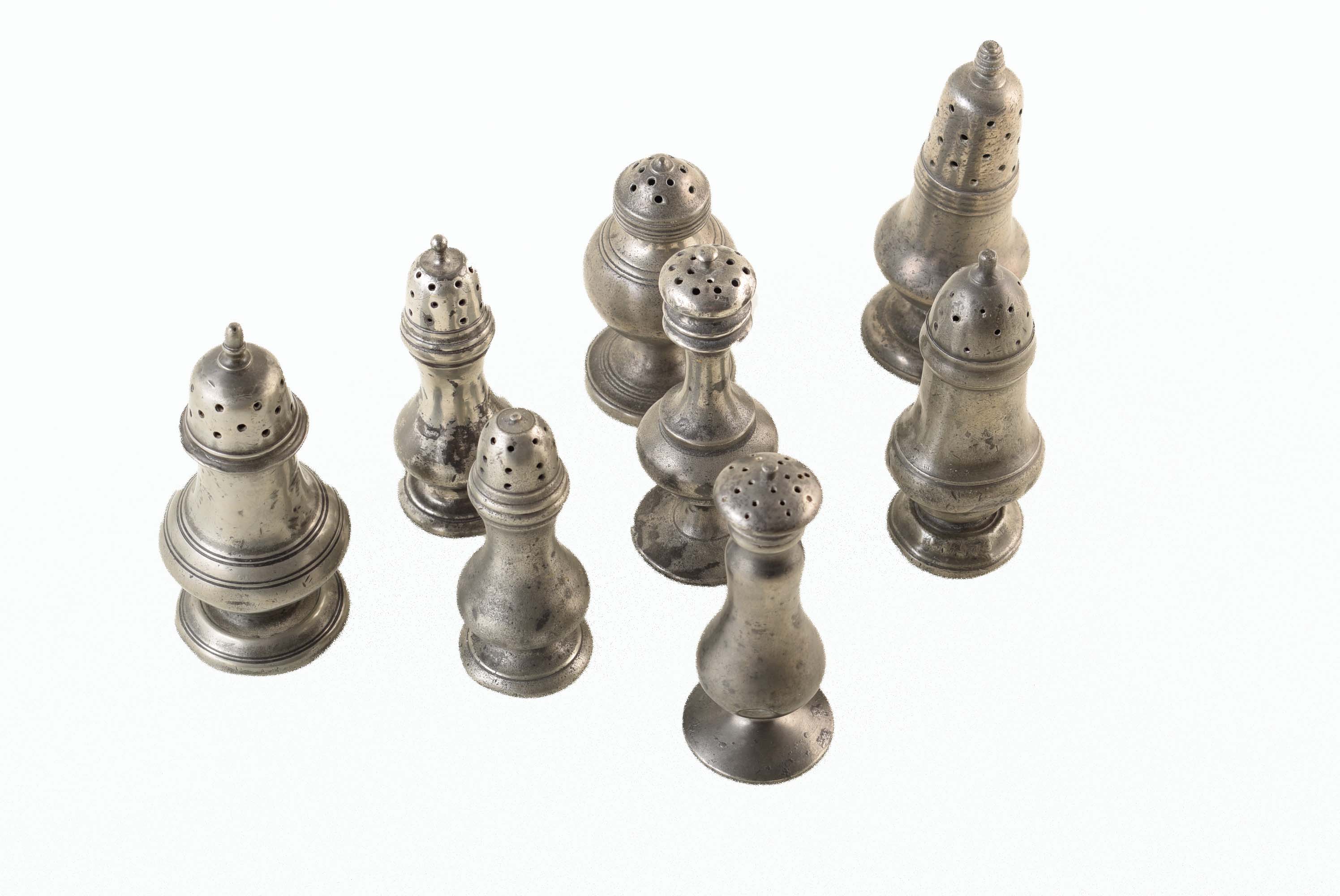 Eight 19th century pewter pepperettes of varying designs. For a condition report on this lot visit