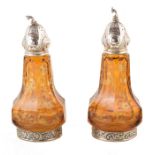 Two German amber glass and silver salts , faceted baluster form glass bodies with engraved floral