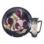 Moorcroft twin handled vase and a charger, decorated with Snowdrops pattern after Rachel Bishop,