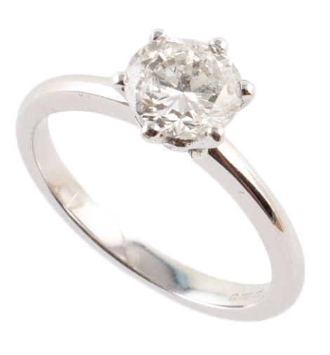 Diamond platinum solitaire ring , the round brilliant cut diamond measuring 1.03 carats, claw set to