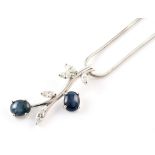 Sapphire and diamond 18ct white gold stylized sprig pendant , 2 oval cabochon cut star sapphires